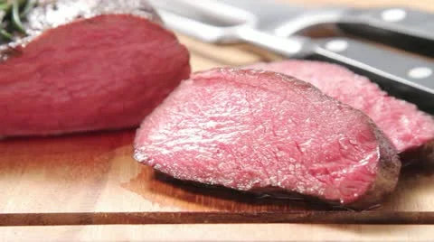 Sliced, rare roasted venison saddle fillet 스톡 동영상 24667887