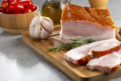 Sliced ??raw bacon on the table. Stock Photos