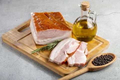 Sliced ??raw bacon on the table. Stock Photos