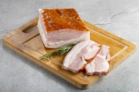 Sliced ??raw bacon on the table. Stock Photos