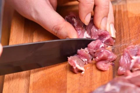 Sliced raw mutton meat. Preparation of mutton meat for cooking dinner. The kn Stock-Fotos