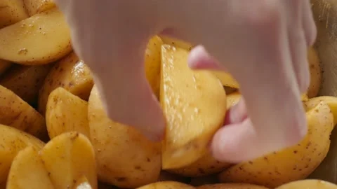 Sliced raw potatoes on plate Stock Footage 142283183