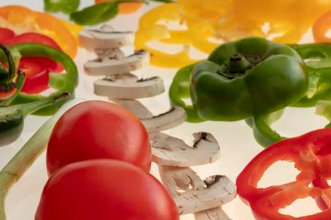 Sliced raw vegetables on white background Stock Photos