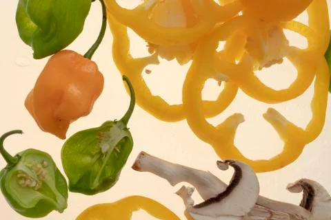 Sliced raw vegetables on white background Stock Photos