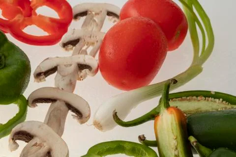 Sliced raw vegetables on white background Stock Photos