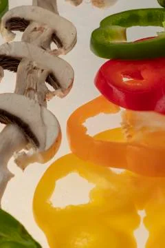 Sliced raw vegetables on white background Stock Photos