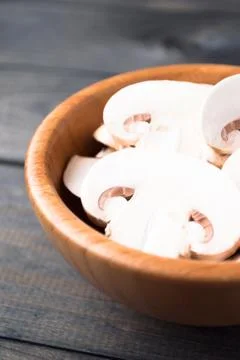 Sliced raw white champignons preparing for cooking Stock Photos