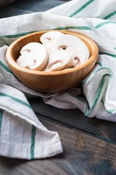 Sliced raw white champignons preparing for cooking Stock Photos