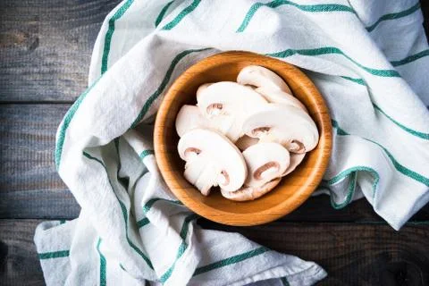 Sliced raw white champignons preparing for cooking Stock Photos