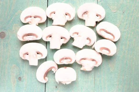 Sliced raw white champignons preparing for cooking Stock Photos