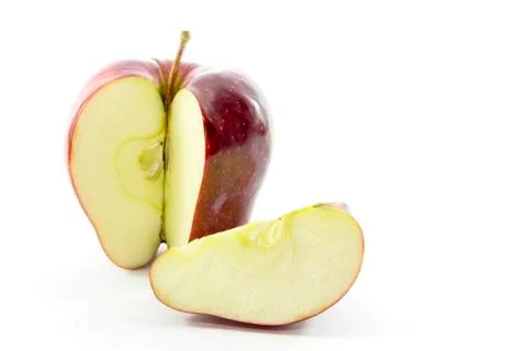 Sliced red apple in quarter Stock Photos