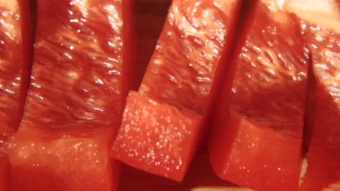 Sliced red bell pepper. 4K resolution macro trucking shot. Stock Footage 118543830