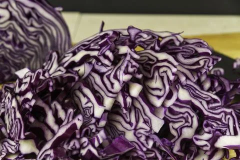 Sliced red cabbage on chopping  board. Stock Photos