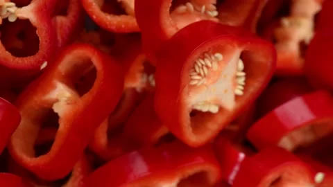 Sliced red Capia pepper rings rotating, crunchy texture, vibrant color Stock Footage 327464987