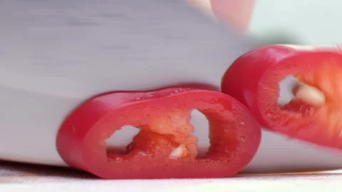 Sliced red chili pepper close up. White background Stock Footage 88265978