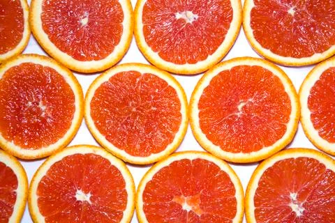 Sliced red grapefruit background texture Stock Photos