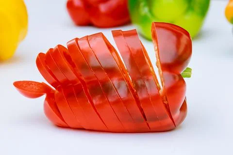 Sliced red pepper on a white background. Stock Photos