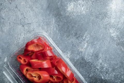 Sliced red peppers in plastic container Stock Photos