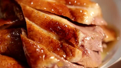 Sliced roast goose placed on a rotating plate, macro close-up2 Stock Footage 236529039