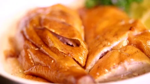 Sliced roast goose placed on a rotating plate, macro close-up4 Stock Footage 236529044