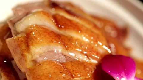 Sliced roast goose placed on a rotating plate, macro close-up Stock Footage 236529045