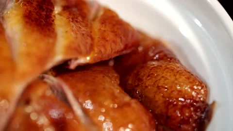 Sliced roast goose placed on a rotating plate, macro close-up5 Stock Footage 236529051