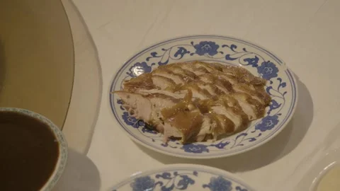 Sliced Roast Poultry on Decorative Plate at Restaurant Table in Beijing, China Stock Footage 345770023