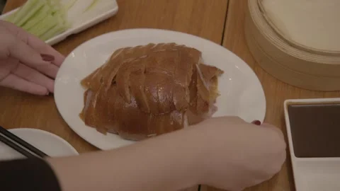 Sliced Roasted Meat Being Served With Condiments and Pancakes in Beijing Stock Footage 345768445