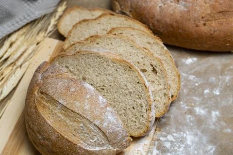 Sliced Rustic Bread with Wheat Stock Photos