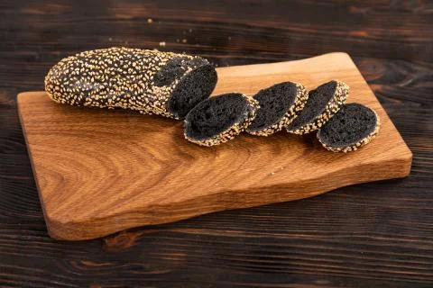 Sliced rye bread and knife on a cutting board Stock Photos