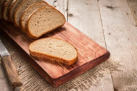 Sliced rye bread on cutting board Stock Photos