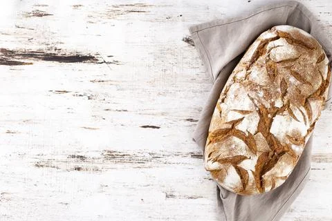 Sliced rye bread on cutting board, closeup. Stock Photos