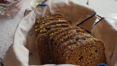 Sliced rye bread in rustic basket. Perfect for culinary projects and bakery Stock Footage 331689239
