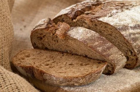 Sliced rye bread sprinkled with white powder Stock Photos