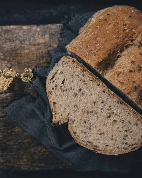 Sliced, rye bread on a wooden surface. Stock Photos