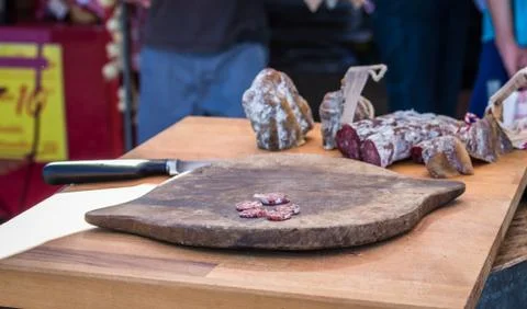 Sliced salami on the board Stock Photos
