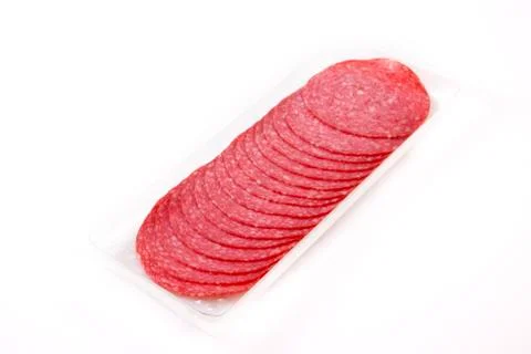 Sliced salami on the package Stock Photos