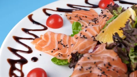 Sliced Salmon salad with vegetables, close-up view Stock Footage 78669878