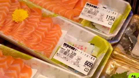Sliced Sashimi salmon in boxes sold at street food market. Stock Footage 133214431