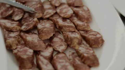 Sliced sausage on a plate Stock Footage 122385146