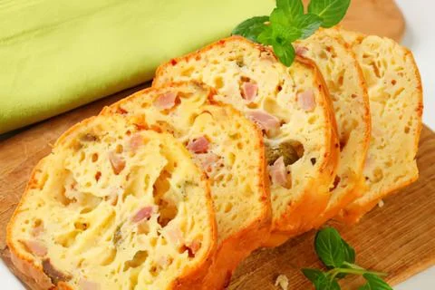 Sliced savory bread with herbs and cheese Stock Photos