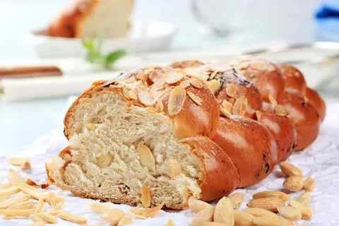 Sliced seeded bread on table with nuts Stock Photos