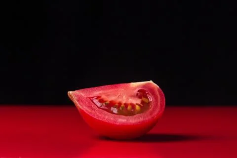 A sliced slice of red tomato Stock Photos