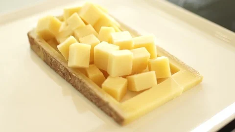 Sliced slices of cheese on the Board Video stock 71504190