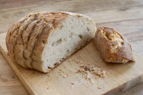 Sliced sourdough bread on board Stock Photos