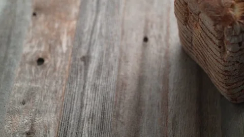 Sliced sourdough bread falling on a table. Slow Motion. Stock Footage 84933949