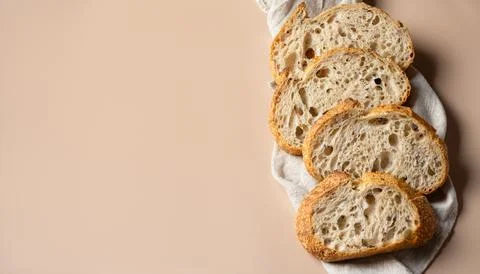 Sliced sourdough bread on a linen towel. Fresh homemade artisan bread, organic Stock Photos
