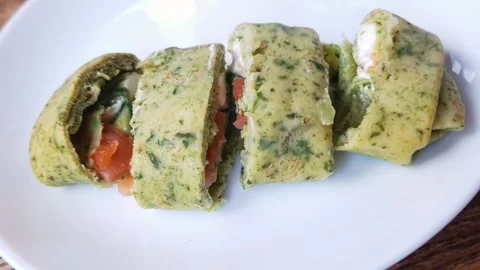 Sliced Spinach Omelet Rolls with Smoked Salmon and Cream Cheese Stock Footage 339080280