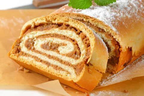 Sliced spiral nut bread on parchment paper Stock Photos