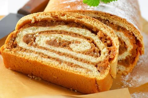 Sliced spiral nut bread on parchment paper Stock Photos